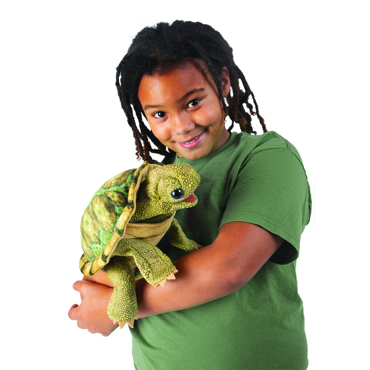 Child holding the Folkmanis standing tortoise hand puppet with an open mouth and a detailed, textured green shell