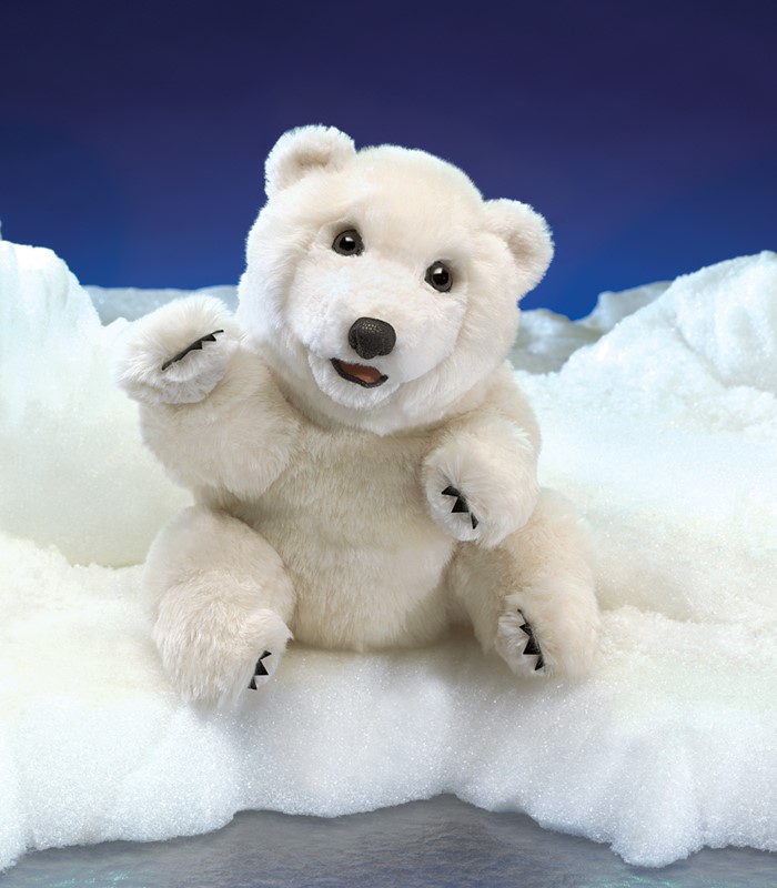 Folkmanis hand puppet sitting polar bear in white plush with open mouth and raised paw in front of an ice backdrop