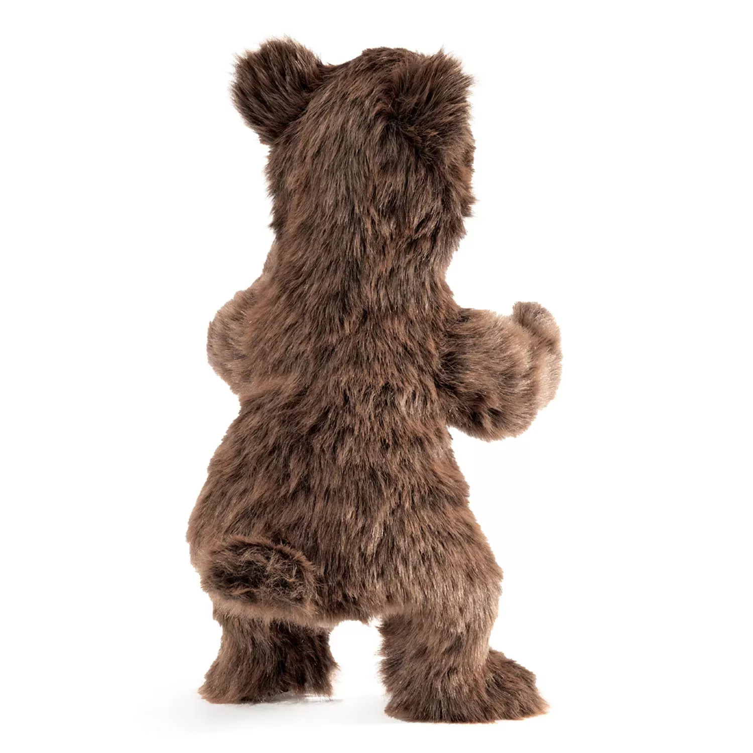 Folkmanis brown bear cub hand puppet in long-pile plush, photographed standing from behind with one paw slightly raised