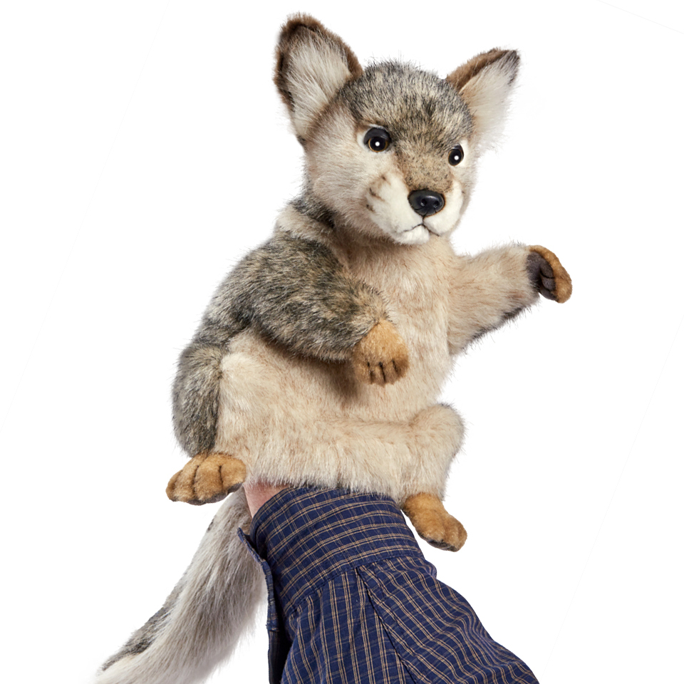 Wolf hand puppet by Hansa Creation with grey-beige fur, a light chest and a bushy tail