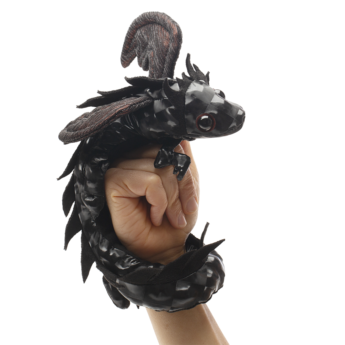 Folkmanis black dragon wristlet finger puppet wrapped around a hand, with shiny scales and red eyes