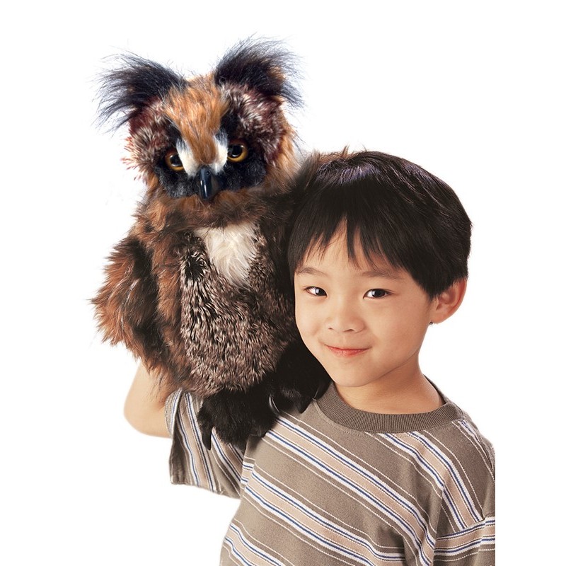 Folkmanis owl hand puppet with brown plumage and yellow eyes, worn on a child's hand