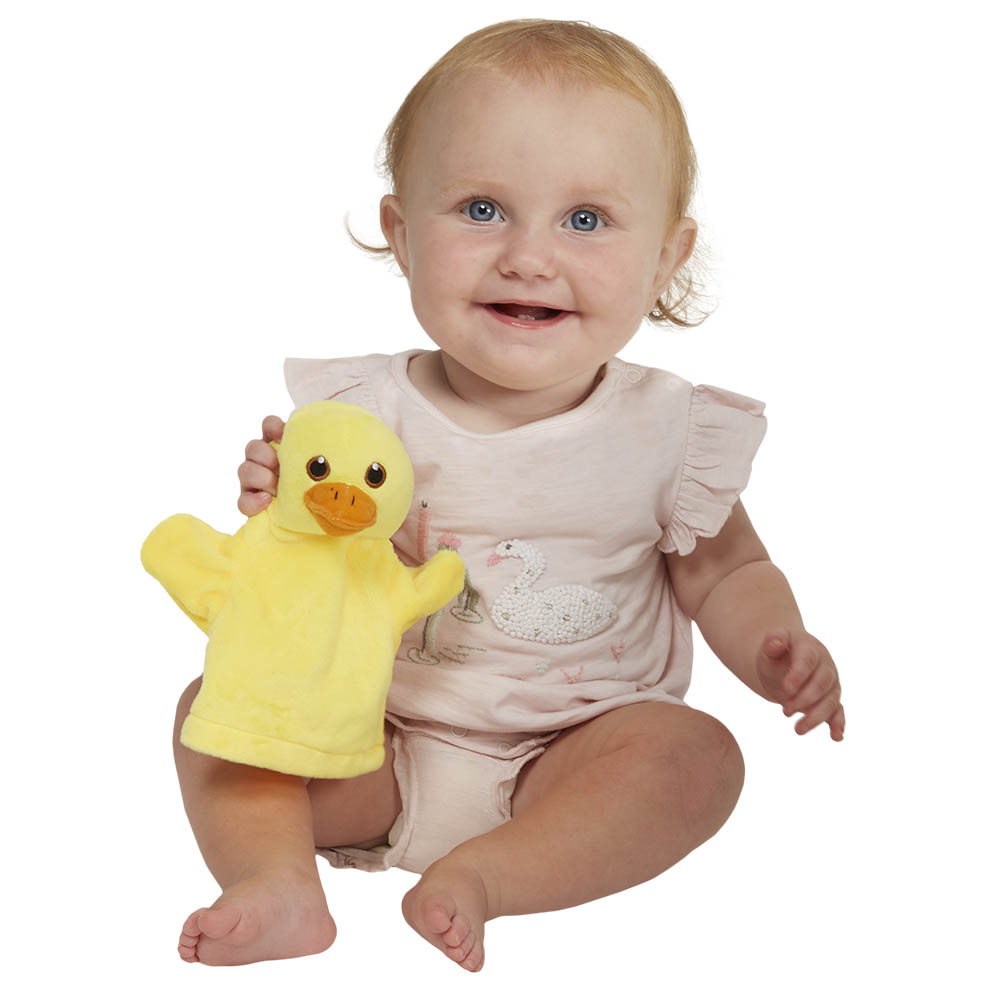 Baby holding the The Puppet Company baby hand puppet duck, usage example