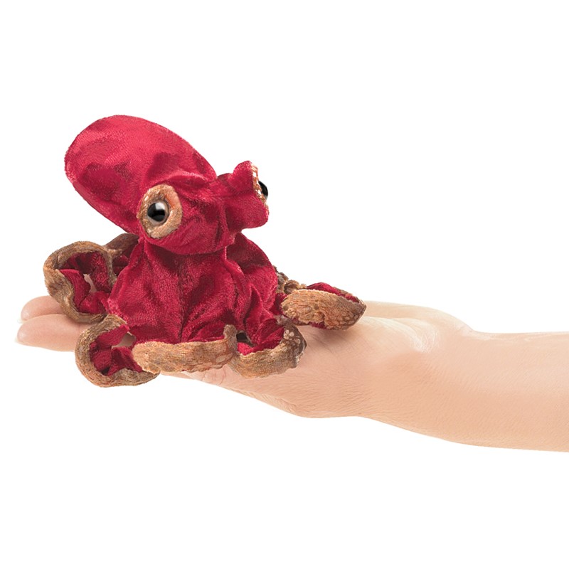 Folkmanis mini finger puppet octopus in dark red with brown tentacles, lying on a palm, side view