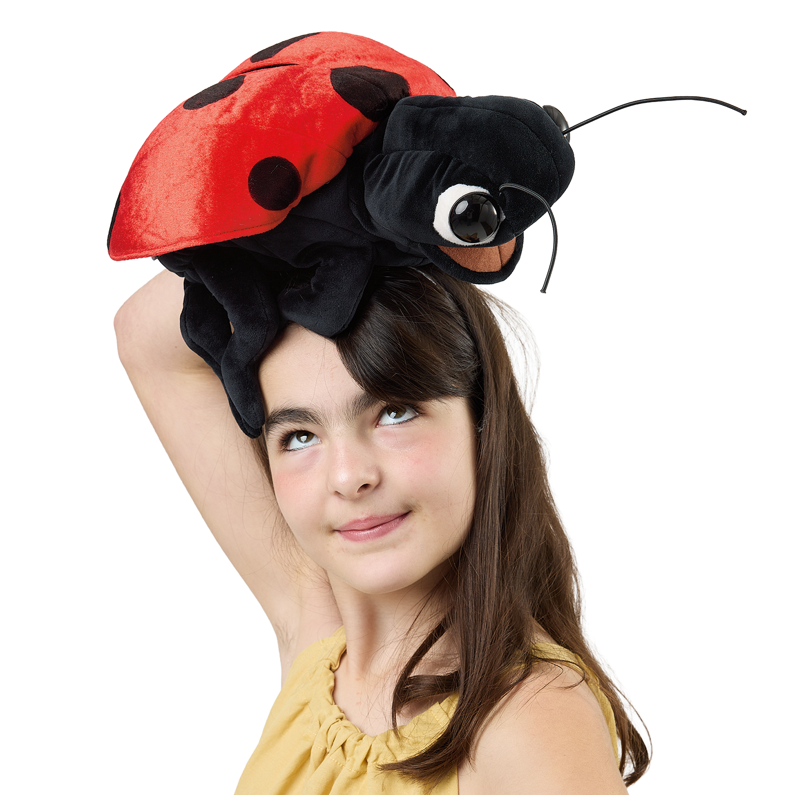 Folkmanis ladybird hand puppet perched like a hat on a girl's head, its mandibles open.