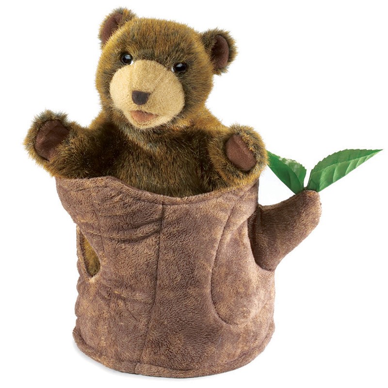 Folkmanis bear in tree stump hand puppet: a brown melange plush bear peeks out of a tree stump with green sprouting leaves
