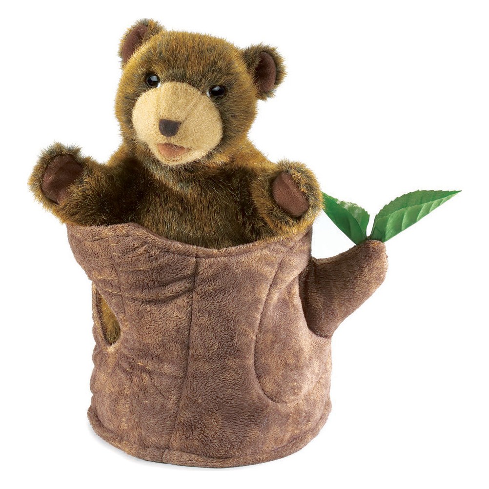 Folkmanis bear in tree stump hand puppet: a brown melange plush bear peeks out of a tree stump with green sprouting leaves