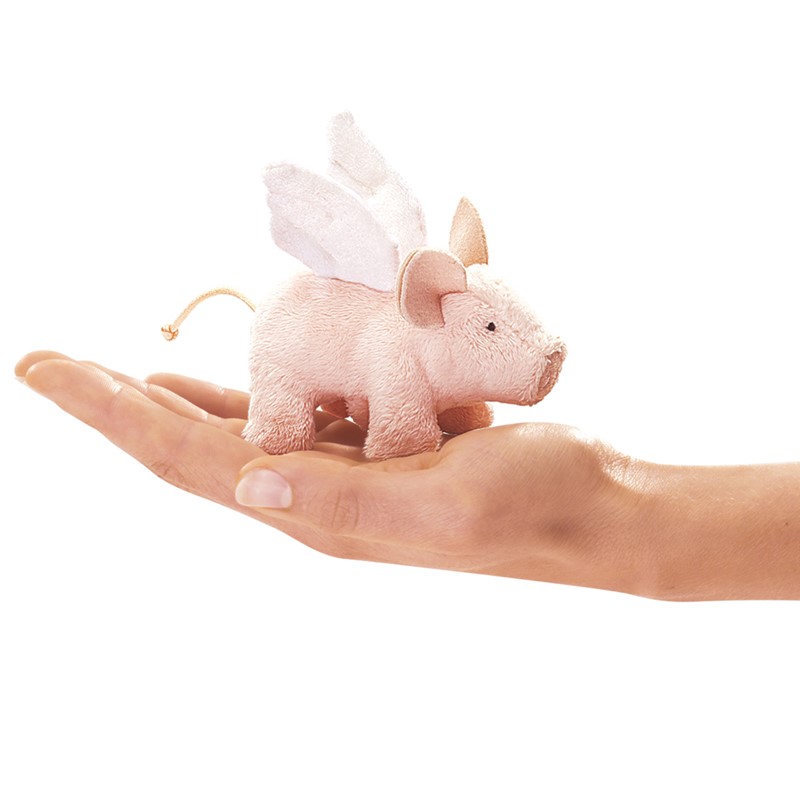 Folkmanis mini flying pig finger puppet with white wings in pink plush, lying on a palm