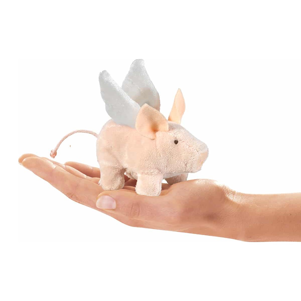 Folkmanis mini flying pig finger puppet with white wings in pink plush, lying on a palm