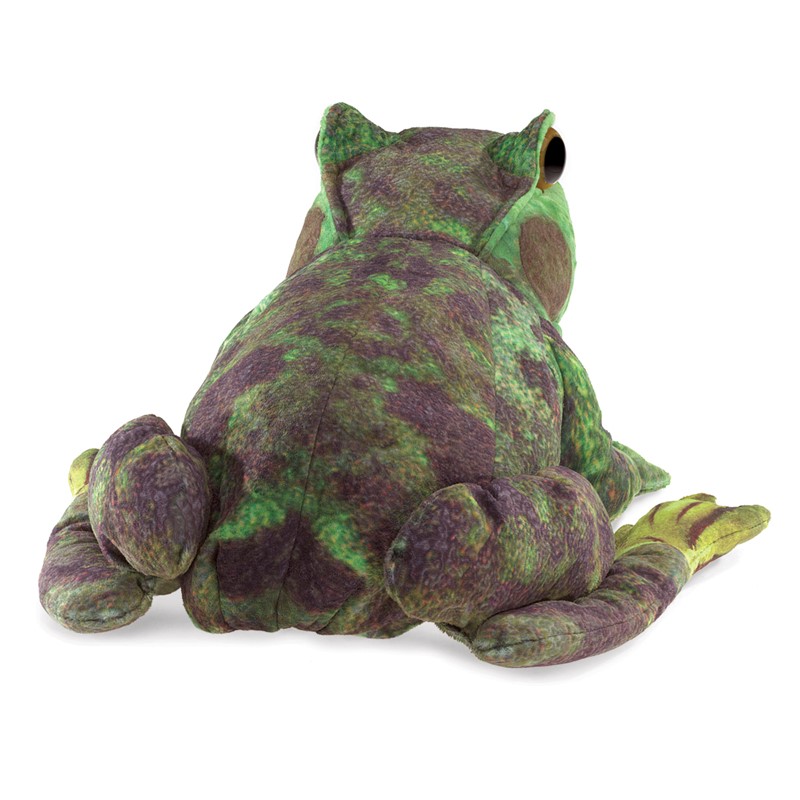 Folkmanis frog metamorphosis hand puppet seen from behind, green and purple mottled plush, seated pose, one eye visible