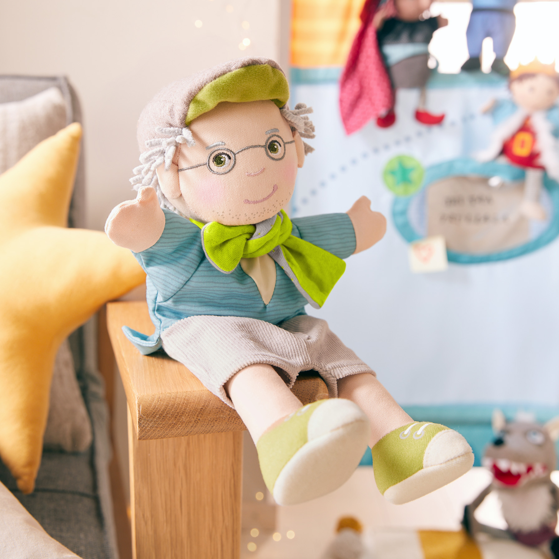 HABA baby hand puppet grandpa Peter, lifestyle photo in front of a puppet theatre