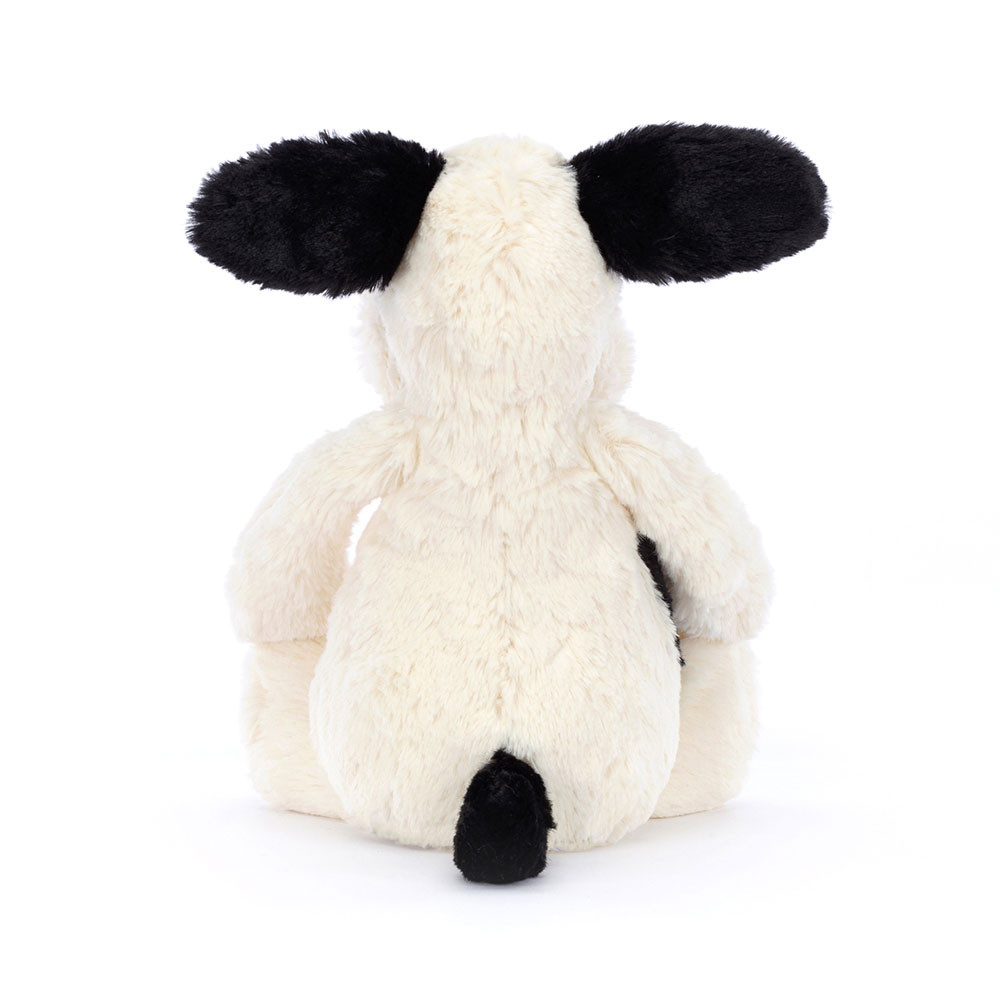 Jellycat plush toy Bashful Puppy Black Cream, back view with black ears and a black tail