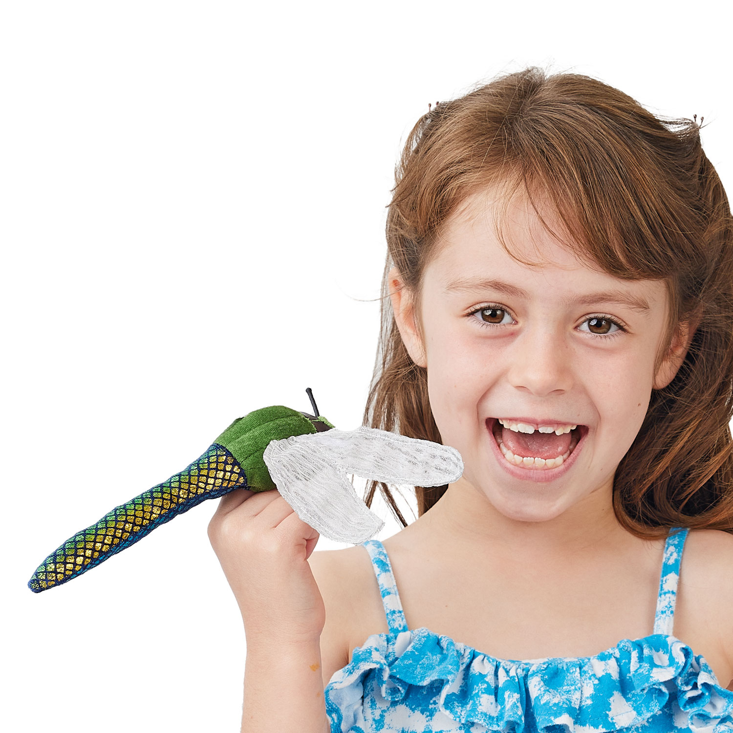 Folkmanis mini dragonfly finger puppet with a green, blue and gold body and transparent mesh wings, held on the finger of a smiling girl