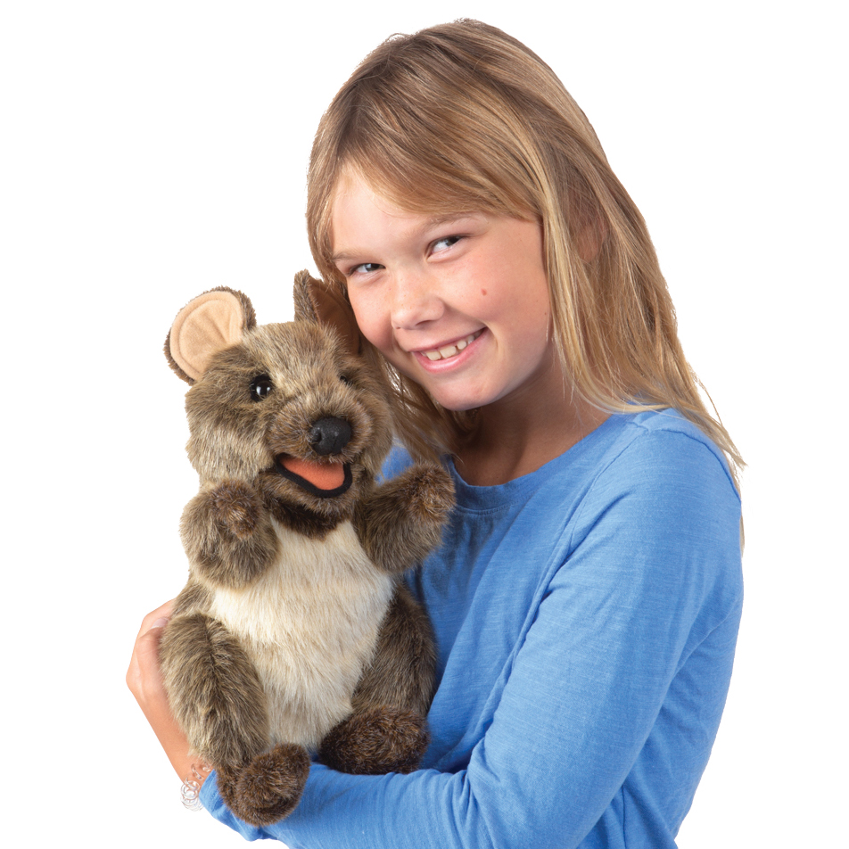 Folkmanis quokka hand puppet with brown fur and movable mouth, held by a girl