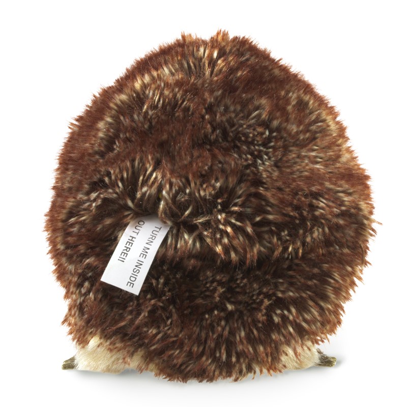 Folkmanis hedgehog hand puppet seen from behind with brown-flecked plush fur and the label reading Turn Me Inside Out Here