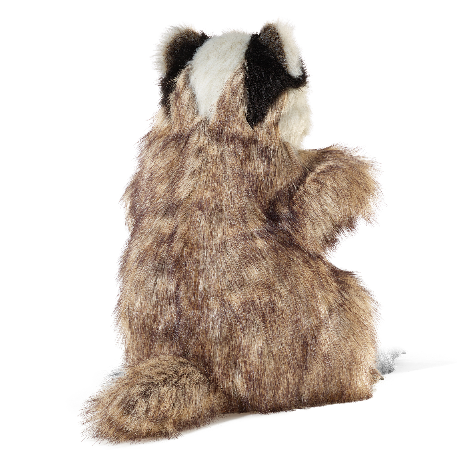 Folkmanis badger hand puppet seen from behind, showing its bushy tail, brownish-grey back fur and one raised front paw.