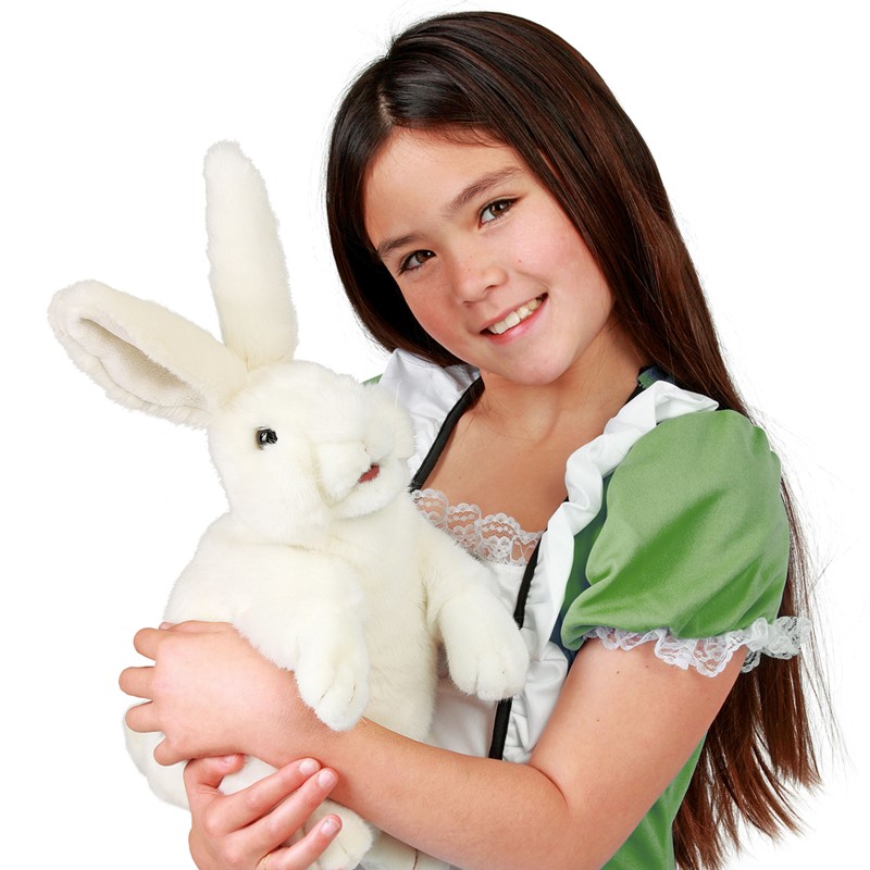 Girl holding a white Folkmanis standing rabbit hand puppet with long ears in her arms