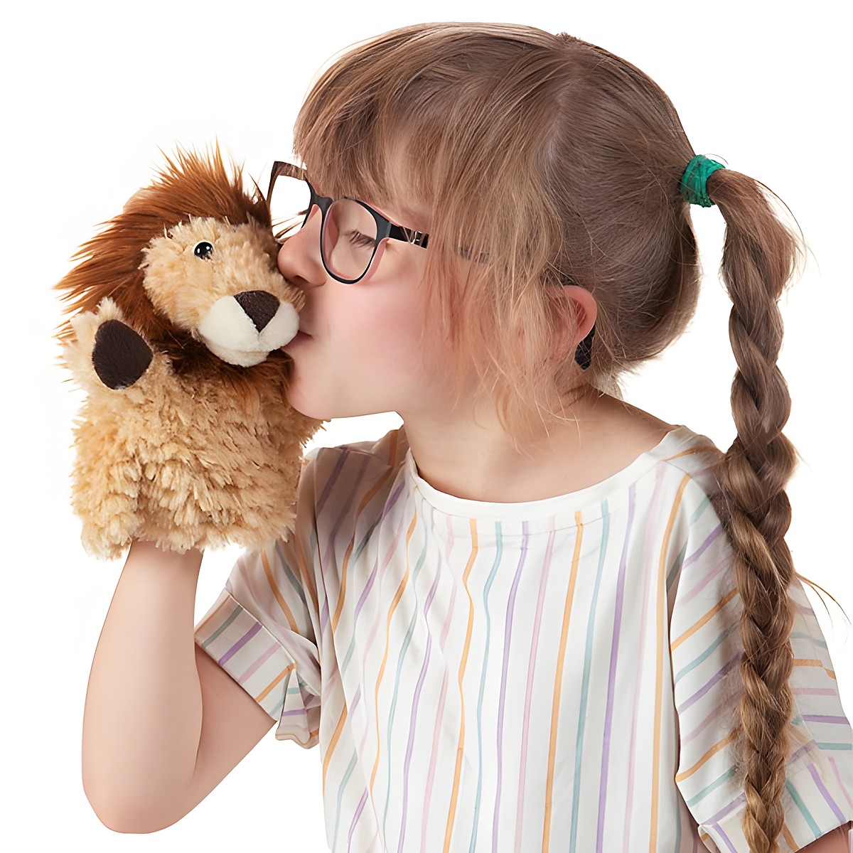Girl with braids kissing a Folkmanis little lion hand puppet with light brown plush fur and a dark mane