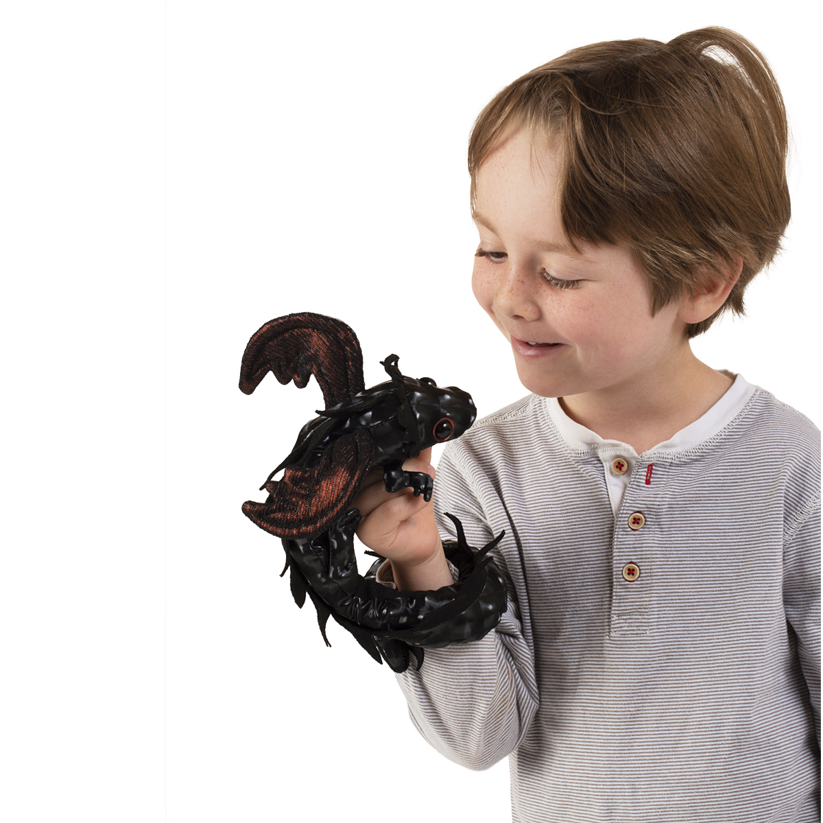 Folkmanis finger puppet dragon wristlet in black with red-brown wings, worn on a child's hand