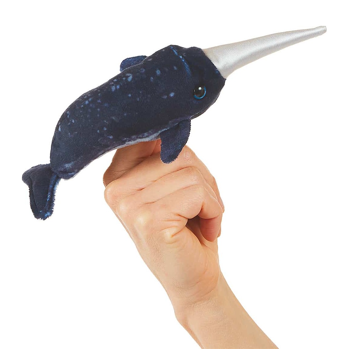 Folkmanis mini narwhal finger puppet in dark blue with a silver horn, worn on an index finger, side view