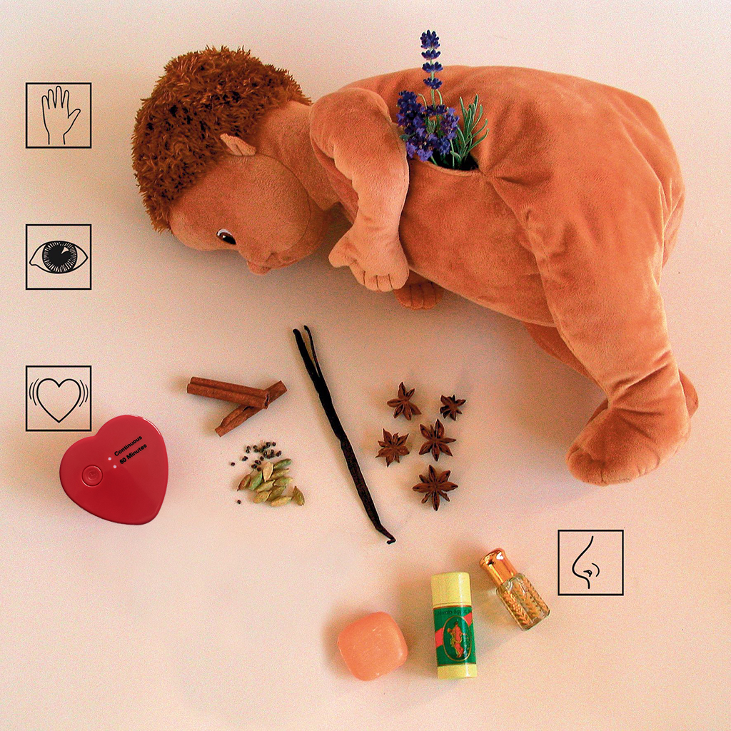 Joyk empathy doll lying down with heartbeat simulator and scent materials for sensory stimulation