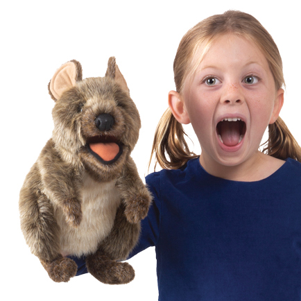Folkmanis quokka hand puppet with open mouth, worn on the hand of a girl