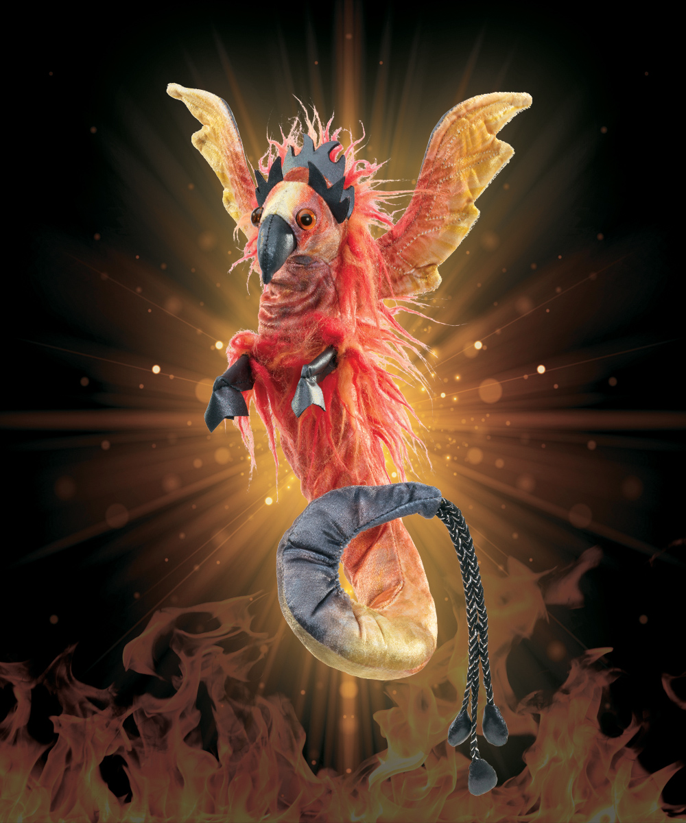 Folkmanis finger puppet phoenix with red-orange plumage, spread wings and a grey tail wristband, against a flames background