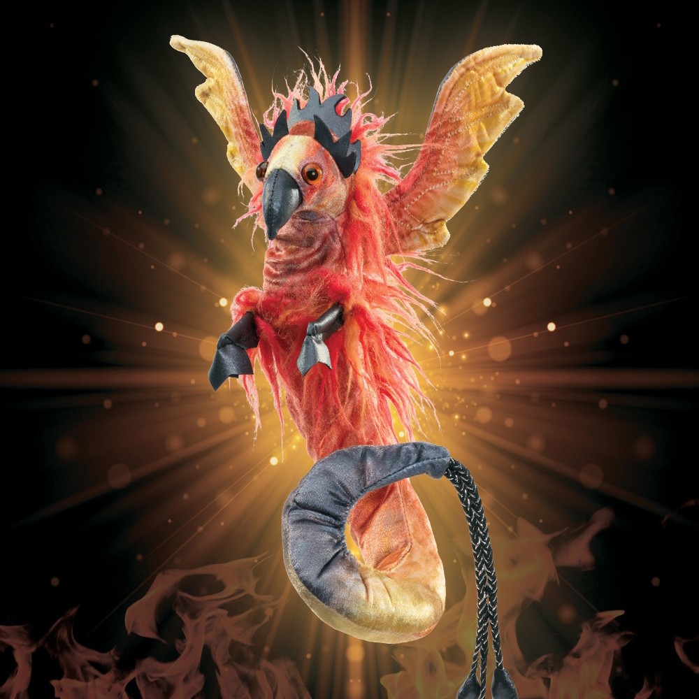 Folkmanis finger puppet phoenix with red-orange plumage, spread wings and a grey tail wristband, against a flames background