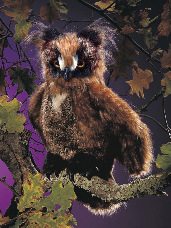 Folkmanis hand puppet owl with reddish-brown plumage and yellow eyes, sitting on a branch, front view
