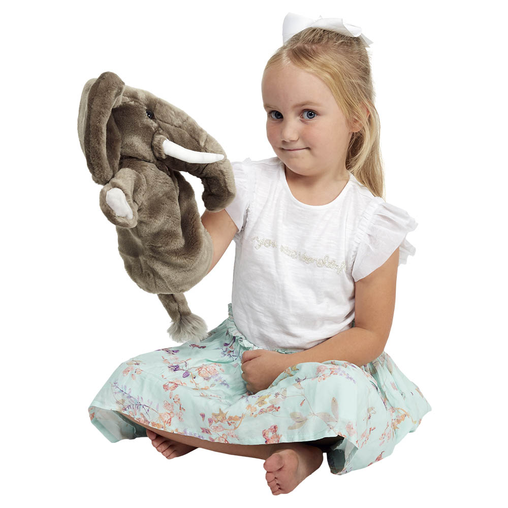 Girl holding the The Puppet Company elephant hand puppet on her hand, usage example