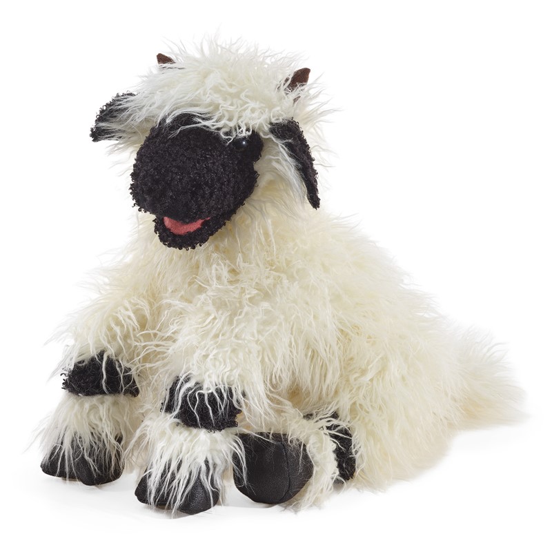 Folkmanis Valais Blacknose Sheep hand puppet with black face, long cream fur and moving mouth, shown lying down