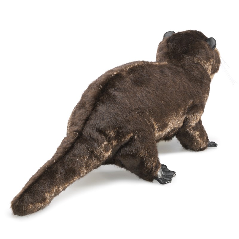 Folkmanis river otter hand puppet in dark brown plush, standing at an angle seen from behind with a characteristic tail and black paws