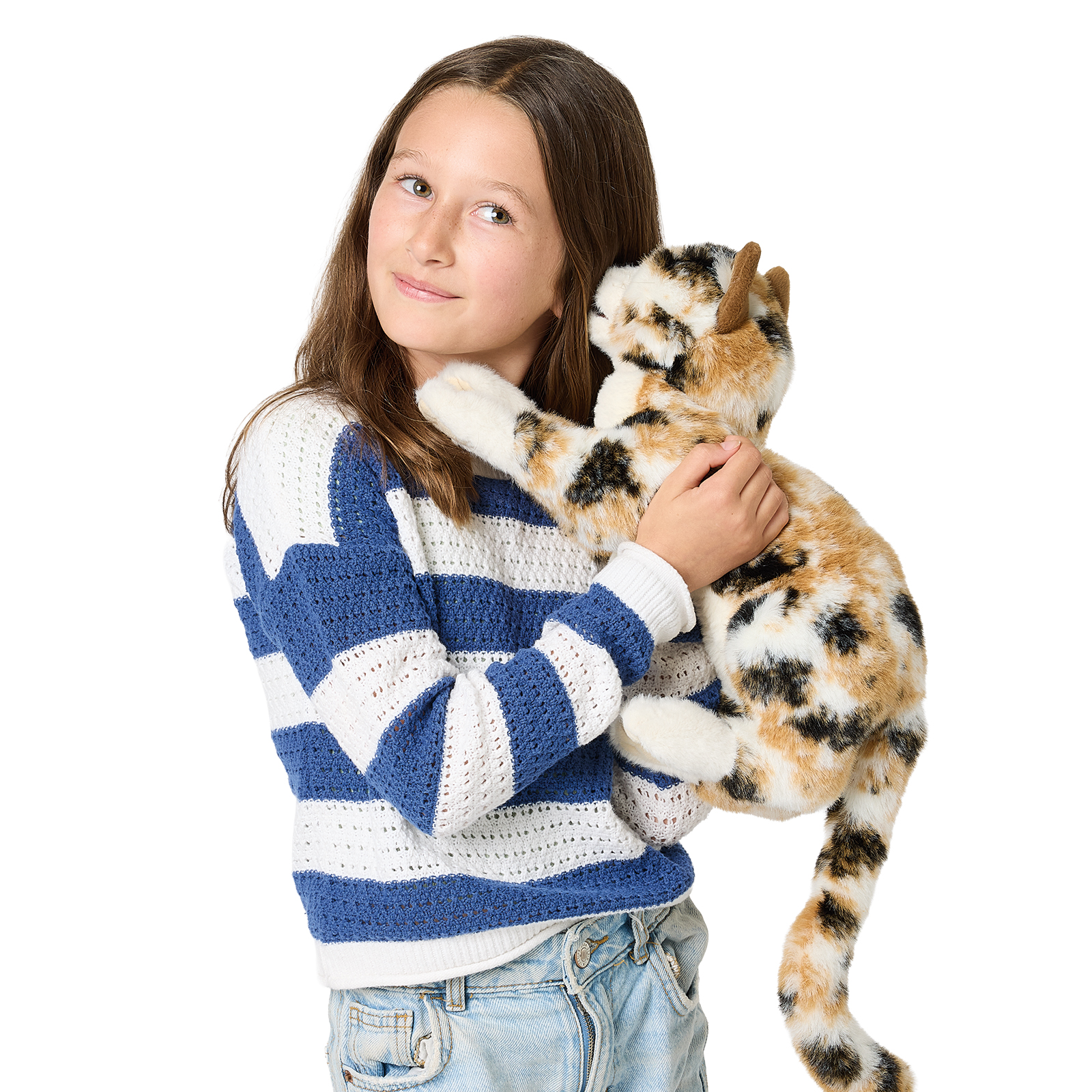 Girl holding a Folkmanis calico cat hand puppet with tricolour tortoiseshell fur in her arms, side view on white background