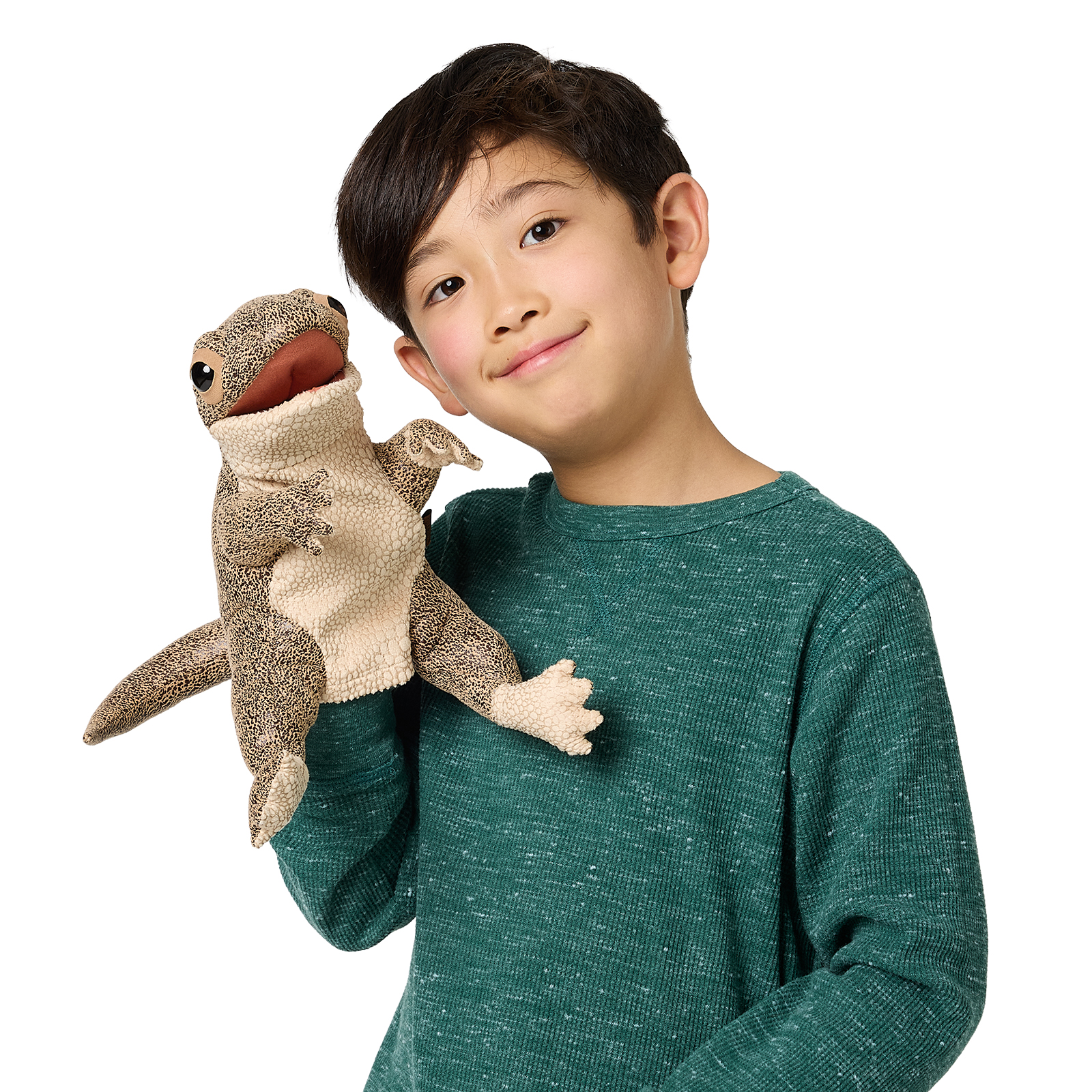 Boy holding a Folkmanis lizard hand puppet with a movable mouth and detailed beige-brown scale texture up in the air