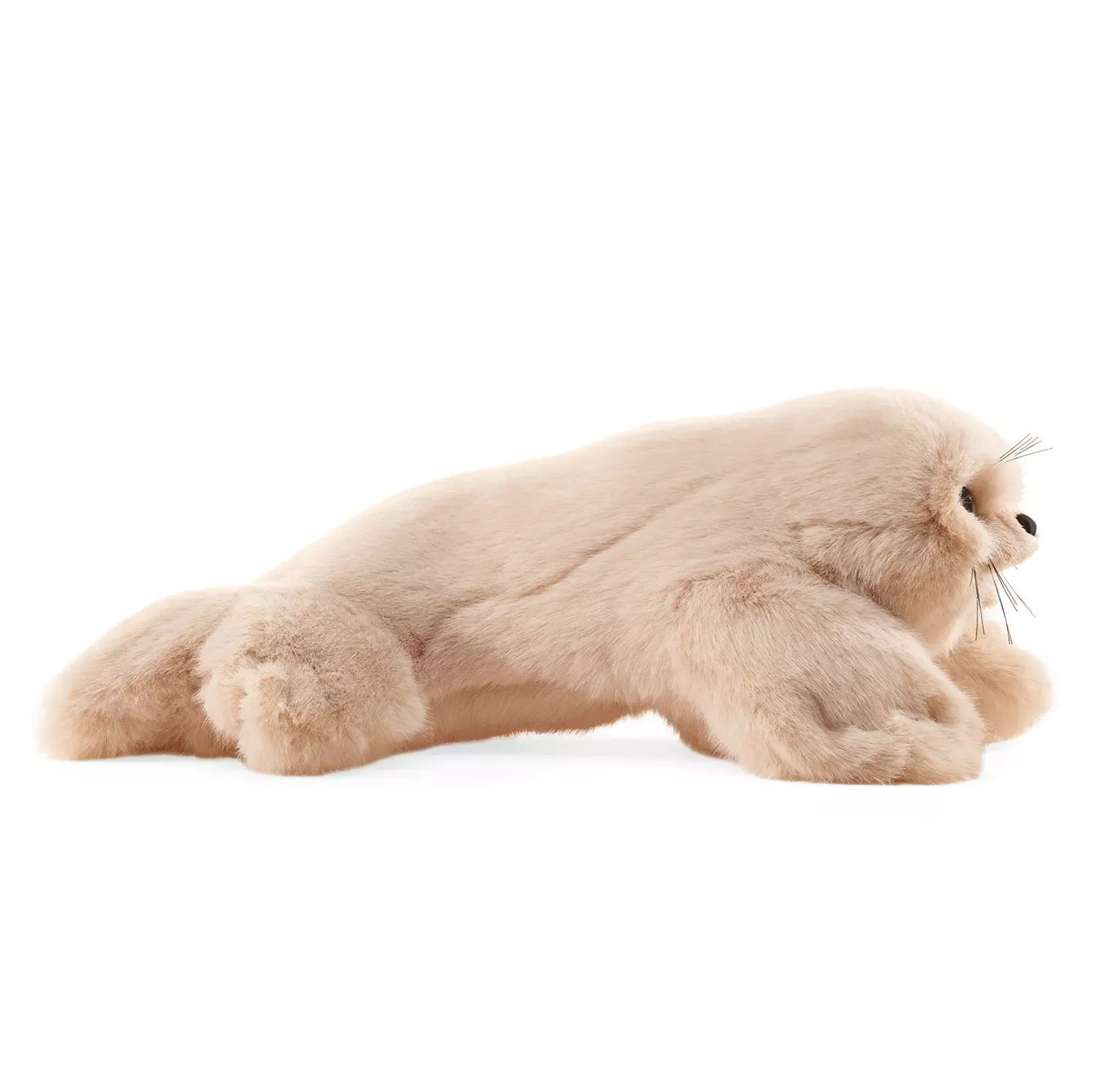 Folkmanis harp seal pup hand puppet in cream plush, shown lying down in side view with whiskers