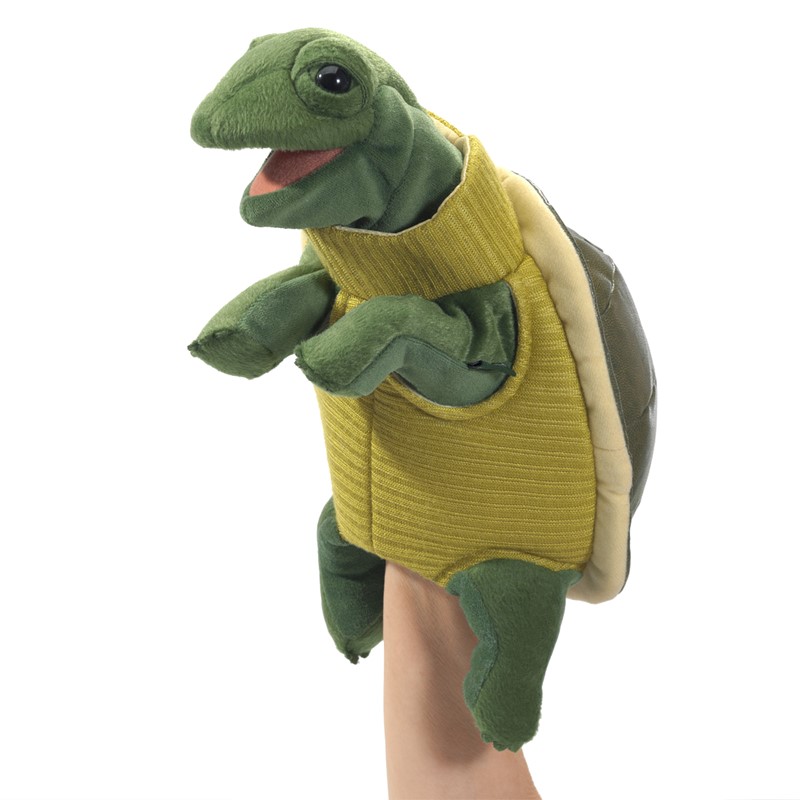 Folkmanis turtle hand puppet with yellow turtleneck, open mouth and green plush body, worn on a hand